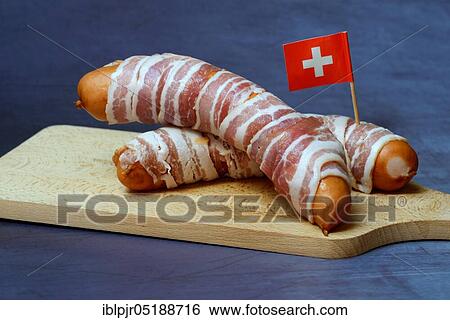 Stock Photograph - Bernerli, Berner sausage, grilled sausage with bacon and cheese. Fotosearch