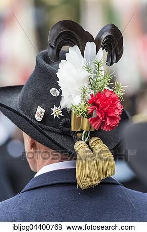 Black hack with brim, feathers, red carnation, badges, tassels in gold, blue jacket, men's costume, Oktoberfest, Munich, Upper Bavaria, Bavaria, Germany, Europe View Large Photo Image Stock Photo - Black hack with brim, feathers, red carnation, badges, tassels in gold, blue jacket, men's costume, Oktoberfest, Munich, Upper Bavaria, Bavaria, Germany, Europe. Fotosearch