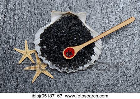 Black Hawaiian salt in shell with spoon, sea salt with activated carbon View Large Photo Image Stock Photo - Black Hawaiian salt in shell with spoon, sea salt with activated carbon. Fotosearch