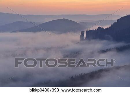 Bloßstock in fog, Dawn in Elbe Sandstone Mountains, Saxon Switzerland, Saxony, Germany, Europe View Large Photo Image Stock Image - Bloßstock in fog, Dawn in Elbe Sandstone Mountains, Saxon Switzerland, Saxony, Germany, Europe. Fotosearch