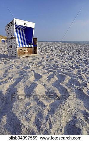 Stock Photo - Blue and white beach chair, Rantum Beach, Sylt, North Frisian Islands, North Frisia, Schleswig-Holstein, Germany, Europe. Fotosearch