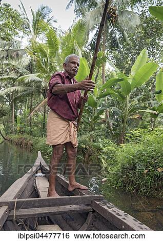 Boatman with punting pole on river, Backwaters, Kerala, India, Asia View Large Photo Image Stock Photograph - Boatman with punting pole on river, Backwaters, Kerala, India, Asia. Fotosearch