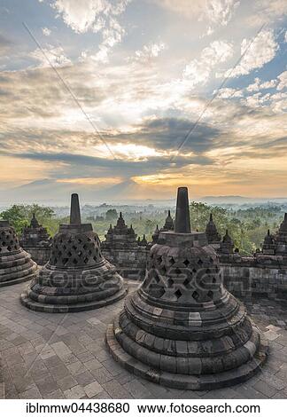 Borobudur Temple at sunrise, stupas, cloudy sky, Borobudur, Yogyakarta, Java, Indonesia, Asia View Large Photo Image Stock Image - Borobudur Temple at sunrise, stupas, cloudy sky, Borobudur, Yogyakarta, Java, Indonesia, Asia. Fotosearch