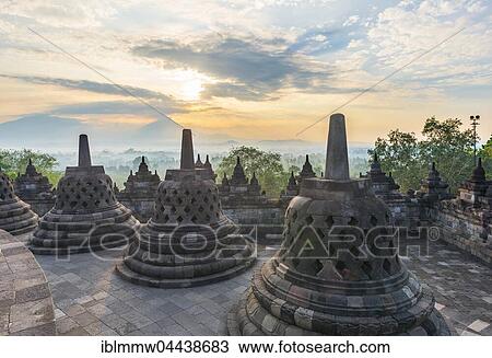 Borobudur Temple at sunrise, stupas, cloudy sky, Borobudur, Yogyakarta, Java, Indonesia, Asia View Large Photo Image Stock Image - Borobudur Temple at sunrise, stupas, cloudy sky, Borobudur, Yogyakarta, Java, Indonesia, Asia. Fotosearch