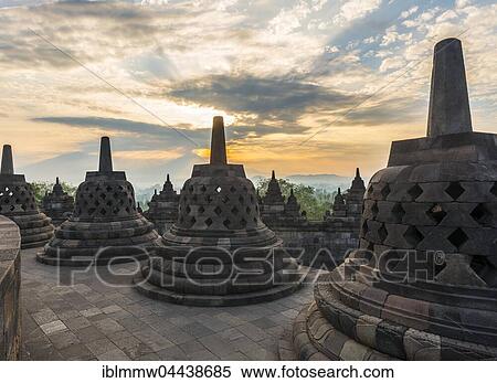 Borobudur Temple at sunrise, stupas, cloudy sky, Borobudur, Yogyakarta, Java, Indonesia, Asia View Large Photo Image Stock Photography - Borobudur Temple at sunrise, stupas, cloudy sky, Borobudur, Yogyakarta, Java, Indonesia, Asia. Fotosearch