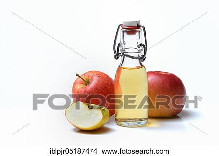 Bottle with apple vinegar and apples View Large Photo Image Picture - Bottle with apple vinegar and apples. Fotosearch