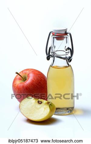 Bottle with apple vinegar and apples View Large Photo Image Stock Image - Bottle with apple vinegar and apples. Fotosearch