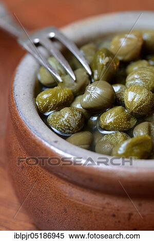 Bowl with capers, pickled ( Capparis spinosa) View Large Photo Image Stock Photography - Bowl with capers, pickled ( Capparis spinosa). Fotosearch