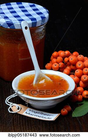 Stock Image - Bowl with rowanberry jam and n ( Sorbus aucuparia). Fotosearch
