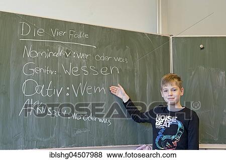 Boy at blackboard in German class, elementary school, Germany, Europe View Large Photo Image Stock Photo - Boy at blackboard in German class, elementary school, Germany, Europe. Fotosearch