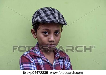 Boy with shirt and flat cap, Portrait, Phnom Penh Province, Cambodia, Asia View Large Photo Image Stock Photo - Boy with shirt and flat cap, Portrait, Phnom Penh Province, Cambodia, Asia. Fotosearch