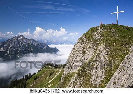 Brandnerschrofen with summit cross, Tegelberg, in the background Säuling, Fussen, Allgäu, Bavaria, Germany, Europe View Large Photo Image Stock Image - Brandnerschrofen with summit cross, Tegelberg, in the background Säuling, Fussen, Allgäu, Bavaria, Germany, Europe. Fotosearch