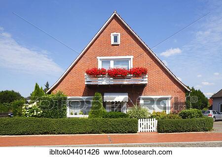Brick house with geraniums on the balcony, Bruchhausen-Vilsen, Lower Saxony, Germany, Europe View Large Photo Image Stock Photograph - Brick house with geraniums on the balcony, Bruchhausen-Vilsen, Lower Saxony, Germany, Europe. Fotosearch