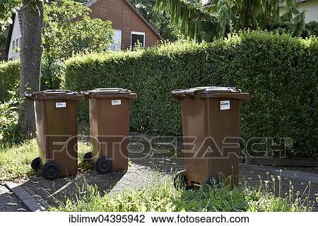 Stock Image - Brown garbage bins for organic waste with barcode labels, Stuttgart, Baden-Württemberg, Germany, Europe. Fotosearch