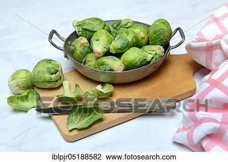 Brussels sprouts in a bowl with kitchen knife, Brassica oleracea gemmifera View Large Photo Image Stock Image - Brussels sprouts in a bowl with kitchen knife, Brassica oleracea gemmifera. Fotosearch