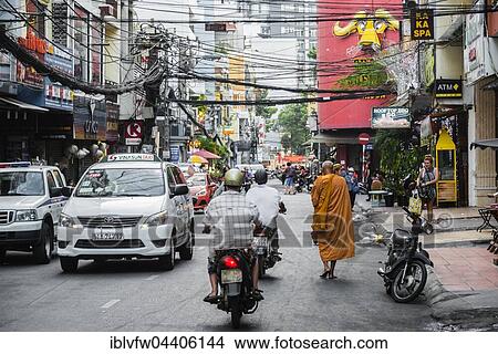 Buddhist monk walking, road, Ho Chi Minh City, Ho Chi Minh City, Vietnam, Asia View Large Photo Image Picture - Buddhist monk walking, road, Ho Chi Minh City, Ho Chi Minh City, Vietnam, Asia. Fotosearch