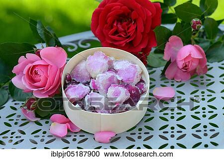 Stock Image - Candied rose petals in box, sugared, sugared, rose petals. Fotosearch