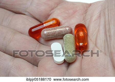 Capsules on hand, Omega-3 fatty acids, vitamins View Large Photo Image Stock Image - Capsules on hand, Omega-3 fatty acids, vitamins. Fotosearch