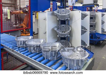 Car parts on a conveyor belt in a car parts factory, Laupheim, Baden-Württemberg, Germany, Europe View Large Photo Image Stock Image - Car parts on a conveyor belt in a car parts factory, Laupheim, Baden-Württemberg, Germany, Europe. Fotosearch