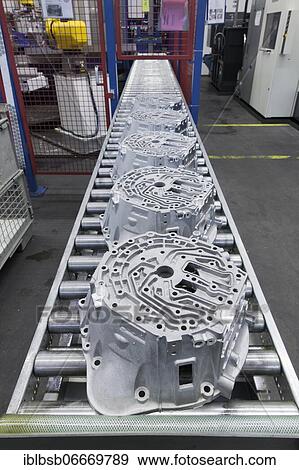 Car parts on a conveyor belt in a car parts factory, Laupheim, Baden-Württemberg, Germany, Europe View Large Photo Image Stock Photo - Car parts on a conveyor belt in a car parts factory, Laupheim, Baden-Württemberg, Germany, Europe. Fotosearch