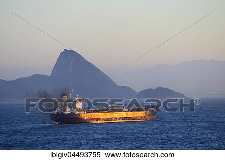 Cargo ship in the morning light, Sugarloaf Mountain at back, Rio de Janeiro, Brazil, South America View Large Photo Image Stock Photography - Cargo ship in the morning light, Sugarloaf Mountain at back, Rio de Janeiro, Brazil, South America. Fotosearch