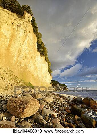 Chalk cliffs in the morning light, boulders on the beach, Jasmund National Park, Rügen, Mecklenburg-Western Pomerania, Germany, Europe View Large Photo Image Stock Image - Chalk cliffs in the morning light, boulders on the beach, Jasmund National Park, Rügen, Mecklenburg-Western Pomerania, Germany, Europe. Fotosearch