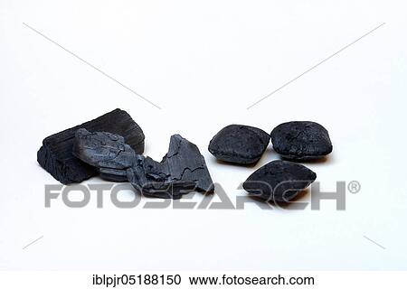 Stock Image - Charcoal and charcoal briquettes. Fotosearch