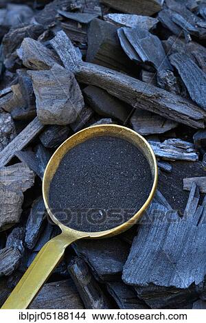 Charcoal and powdered charcoal in trowel, wood, coal, charcoal, powdered charcoal View Large Photo Image Picture - Charcoal and powdered charcoal in trowel, wood, coal, charcoal, powdered charcoal. Fotosearch