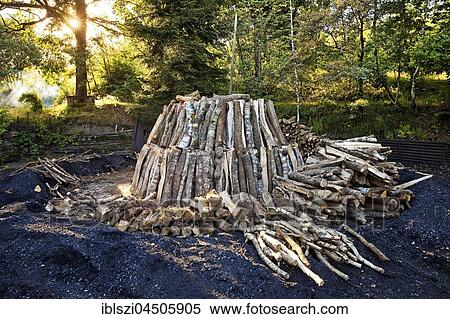 Stock Photography - Charcoal pile with logs, Walpersdorf, Siegerland, North Rhine-Westphalia, Germany, Europe. Fotosearch