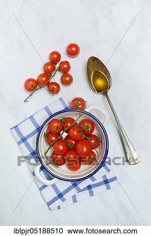 Cherry tomatoes in peel and spoon with olive oil, Solanum lycopersicum, cherry tomato, cherry tomatoes View Large Photo Image Stock Image - Cherry tomatoes in peel and spoon with olive oil, Solanum lycopersicum, cherry tomato, cherry tomatoes. Fotosearch