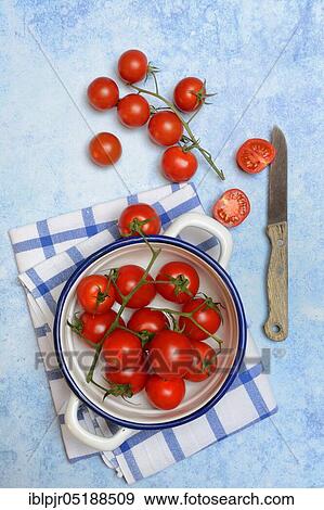 Cherry tomatoes in skin and kitchen knife, Solanum lycopersicum, cherry tomato, cherry tomatoes View Large Photo Image Stock Photo - Cherry tomatoes in skin and kitchen knife, Solanum lycopersicum, cherry tomato, cherry tomatoes. Fotosearch