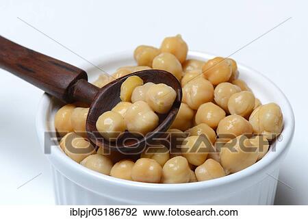 Chickpeas ( Cicer arietinum) in bowl with wooden spoon View Large Photo Image Stock Image - Chickpeas ( Cicer arietinum) in bowl with wooden spoon. Fotosearch