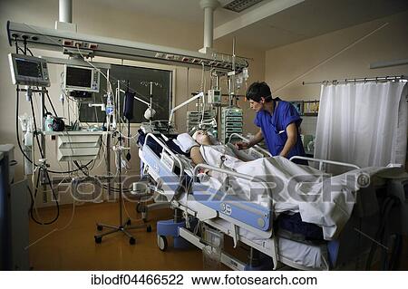 Child in hospital bed is attended by intensive care nurse, Intensive Care Unit, Children's Hospital Altona, Hamburg, Germany, Europe View Large Photo Image Stock Image - Child in hospital bed is attended by intensive care nurse, Intensive Care Unit, Children's Hospital Altona, Hamburg, Germany, Europe. Fotosearch