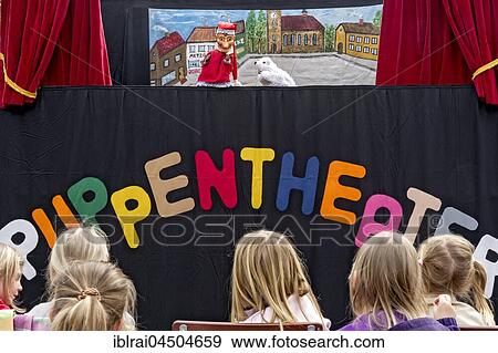 Children watching the puppet theater, Upper Bavaria, Bavaria, Germany, Europe View Large Photo Image Stock Photo - Children watching the puppet theater, Upper Bavaria, Bavaria, Germany, Europe. Fotosearch