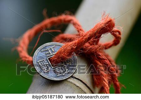 Chinese lucky coins on bamboo View Large Photo Image Stock Image - Chinese lucky coins on bamboo. Fotosearch
