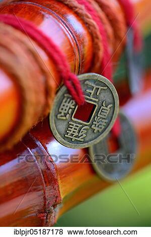Chinese lucky coins on bamboo View Large Photo Image Stock Photo - Chinese lucky coins on bamboo. Fotosearch