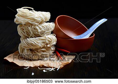Chinese noodles and bowls, uncooked, nest noodles, nest noodles View Large Photo Image Stock Image - Chinese noodles and bowls, uncooked, nest noodles, nest noodles. Fotosearch
