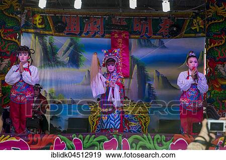 Chinese opera at a temple procession, Yehliu, Wanli District, New Taipei, Taiwan, Asia View Large Photo Image Stock Photo - Chinese opera at a temple procession, Yehliu, Wanli District, New Taipei, Taiwan, Asia. Fotosearch