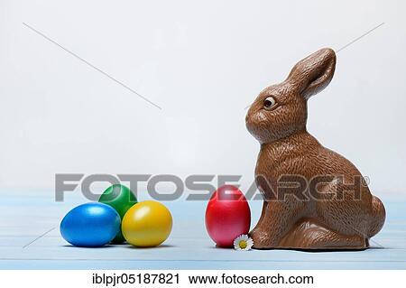 Stock Image - Chocolate Easter bunny and Easter eggs, chocolate bunny. Fotosearch