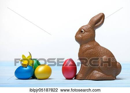 Stock Image - Chocolate Easter bunny and Easter eggs, chocolate bunny. Fotosearch