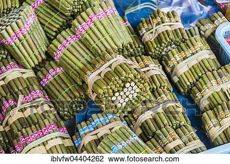 Stock Image - Cigars, cigarillos in bundles, cheroot cigars, market in Nampan, Inle Lake, Shan State, Myanmar, Asia. Fotosearch