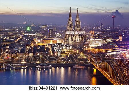 Cityscape with Cologne Cathedral, Hohenzollern Bridge and the Rhine at dusk, Cologne, Rhineland, North Rhine-Westphalia, Germany, Europe View Large Photo Image Stock Image - Cityscape with Cologne Cathedral, Hohenzollern Bridge and the Rhine at dusk, Cologne, Rhineland, North Rhine-Westphalia, Germany, Europe. Fotosearch