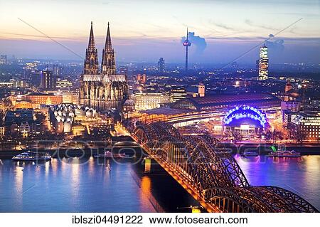 Cityscape with Cologne Cathedral, Hohenzollern Bridge and the Rhine at dusk, Cologne, Rhineland, North Rhine-Westphalia, Germany, Europe View Large Photo Image Stock Image - Cityscape with Cologne Cathedral, Hohenzollern Bridge and the Rhine at dusk, Cologne, Rhineland, North Rhine-Westphalia, Germany, Europe. Fotosearch