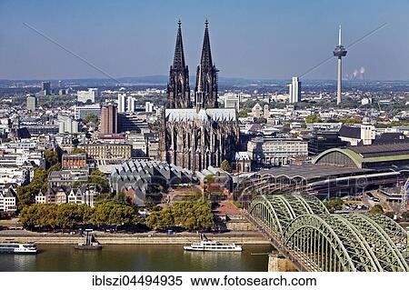 Cityscape with Cologne Cathedral, Hohenzollern Bridge, TV Tower and Rhine, Cologne, Rhineland, North Rhine-Westphalia, Germany, Europe View Large Photo Image Stock Photography - Cityscape with Cologne Cathedral, Hohenzollern Bridge, TV Tower and Rhine, Cologne, Rhineland, North Rhine-Westphalia, Germany, Europe. Fotosearch