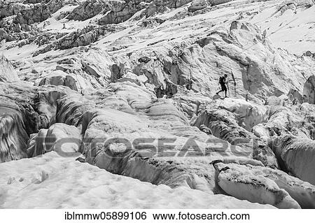 Climber walking on rutted glacier, glacier ice with crevasses, glacier tongue, Glacier des Bossons, La Jonction, Chamonix, Haute-Savoie, France, Europe View Large Photo Image Stock Photograph - Climber walking on rutted glacier, glacier ice with crevasses, glacier tongue, Glacier des Bossons, La Jonction, Chamonix, Haute-Savoie, France, Europe. Fotosearch