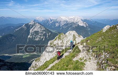Climbers hiking, Mittenwalder Höhenweg, view of Isar valley and mountain panorama, Karwendel mountains, Mittenwald, Bavaria, Germany, Europe View Large Photo Image Stock Image - Climbers hiking, Mittenwalder Höhenweg, view of Isar valley and mountain panorama, Karwendel mountains, Mittenwald, Bavaria, Germany, Europe. Fotosearch