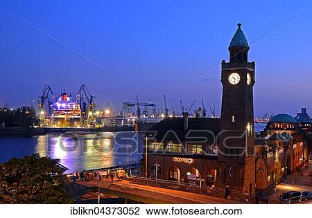 Clock tower overlooking the jetties and dry dock with Queen Mary 2, harbor, Hamburg View Large Photo Image Stock Image - Clock tower overlooking the jetties and dry dock with Queen Mary 2, harbor, Hamburg. Fotosearch