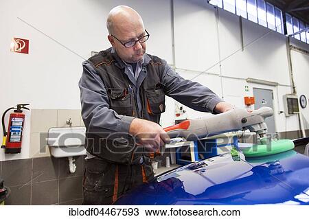 Coachbuilder master with the polishing machine on the car, Düsseldorf, North Rhine-Westphalia, Germany, Europe View Large Photo Image Stock Image - Coachbuilder master with the polishing machine on the car, Düsseldorf, North Rhine-Westphalia, Germany, Europe. Fotosearch
