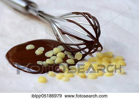 Cocoa butter and melted chocolate coating with whisk( Theobroma cacao), cocoa, melted, chocolate ingredient View Large Photo Image Stock Photo - Cocoa butter and melted chocolate coating with whisk( Theobroma cacao), cocoa, melted, chocolate ingredient. Fotosearch
