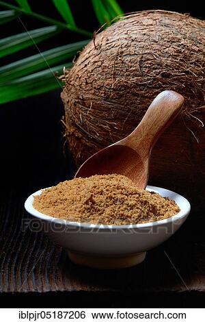 Stock Photograph - Coconut blossom sugar in shell and coconut. Fotosearch